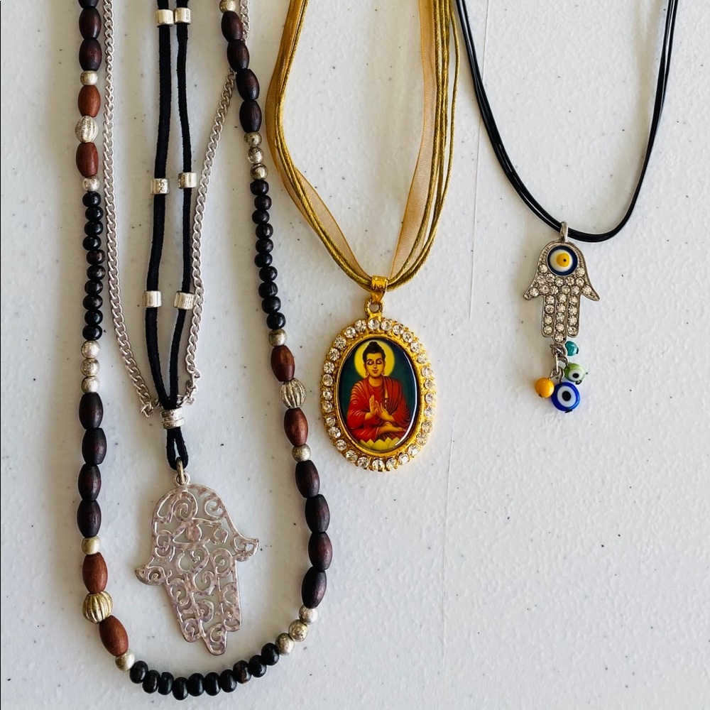 Set of 3 necklaces.  2 Hamsa, 1 Buddha!  Brand new